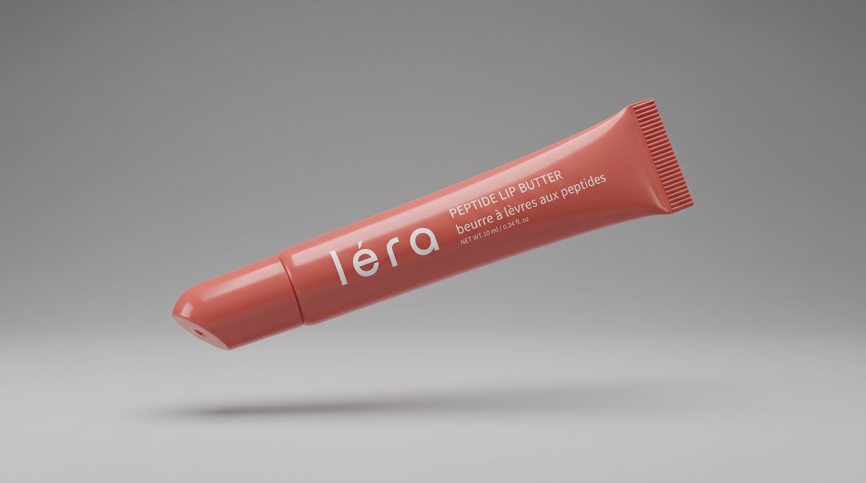 LÉRA Peptide Lip Butter styled on a warm, sunlit surface