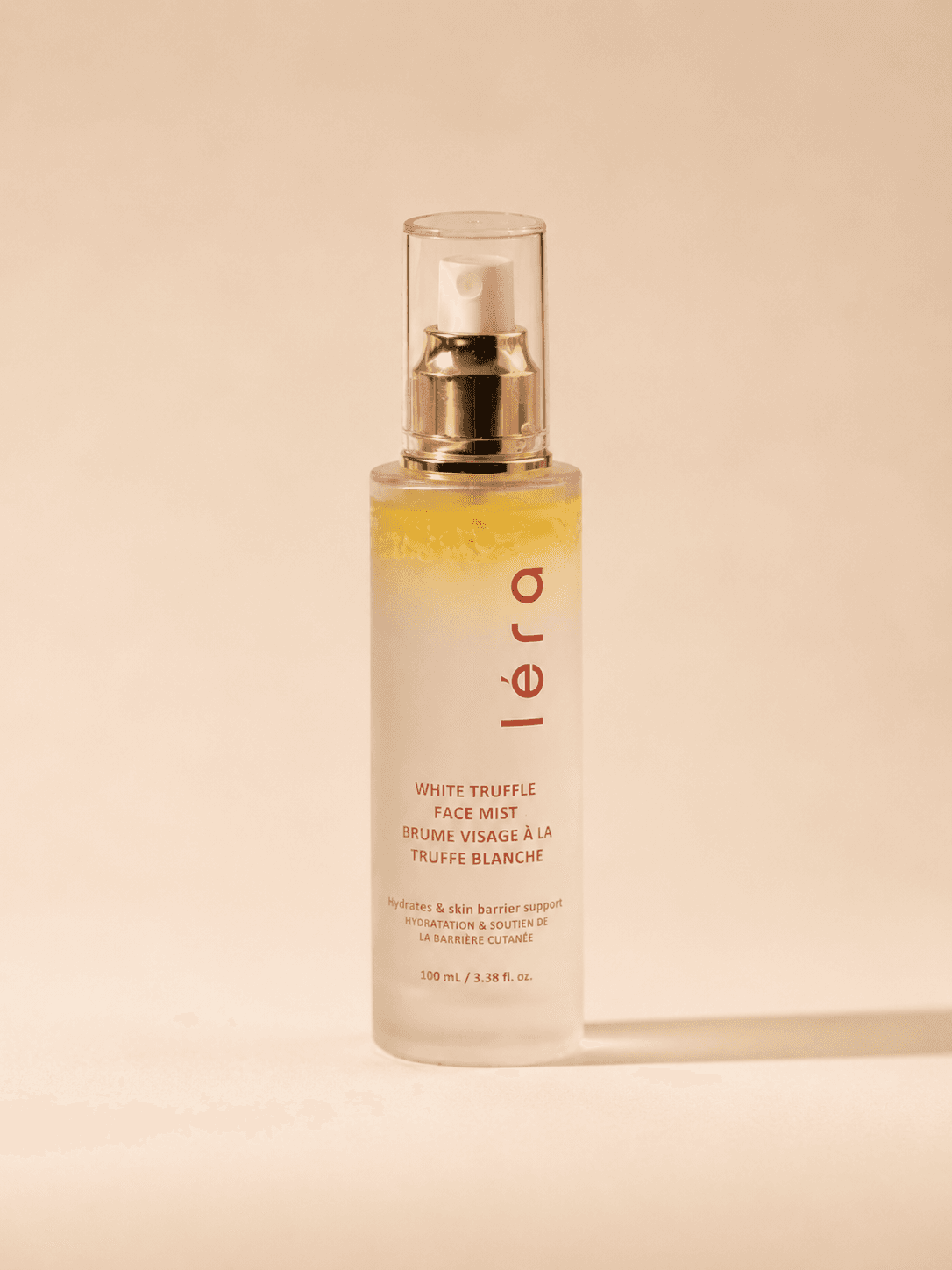 LÉRA White Truffle Mist on a warm, sunlit surface